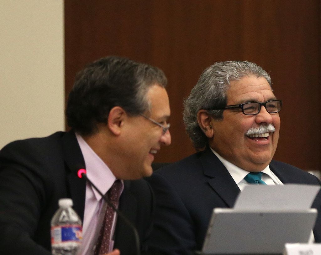 Board president Edwin Flores (left) and Superintendent Michael Hinojosa shared a laugh...
