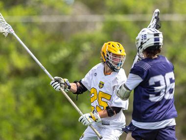 St. Mark's Grant Warnecke (25) looks to pass over Episcopal School of Dallas’ Jack Whitham...