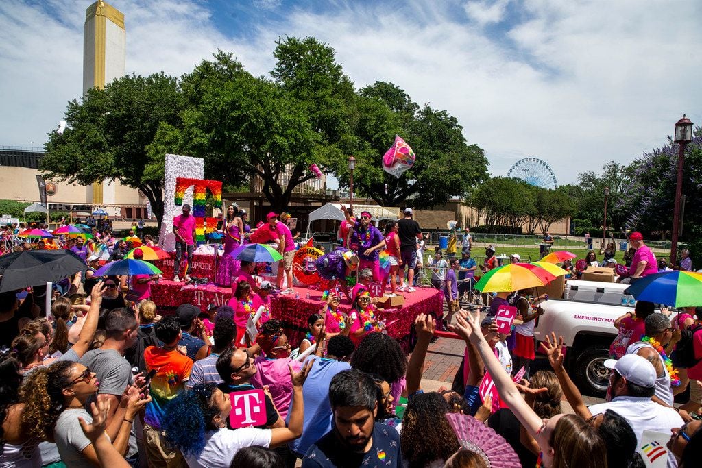 Parade-goers attempt to catch souvenirs during the annual Dallas Pride / Alan Ross Texas Freedom Parade at Fair Park in Dallas on Sunday, June 2, 2019. (Shaban Athuman/Staff Photographer)