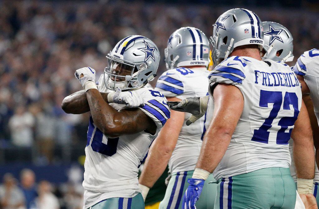 Dallas Cowboys wide receiver Dez Bryant (88) celebrates for his touchdown with teammates...