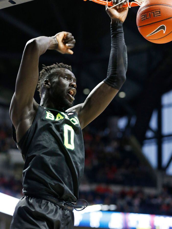 Baylor forward Jo Lual-Acuil Jr. (0) dunks against Mississippi in the first half of an NCAA...