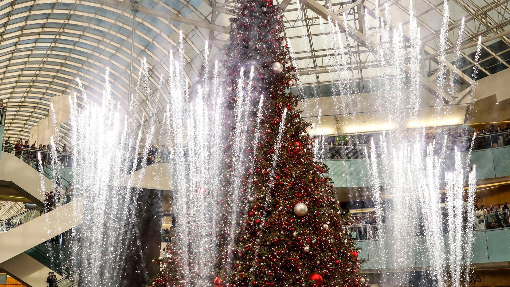 The indoor Christmas tree gets lit during Black Friday at Galleria Dallas. The 95-foot tall tree is among the attractions "Condé Nast Traveler" says make Dallas a place to visit this holiday season.
