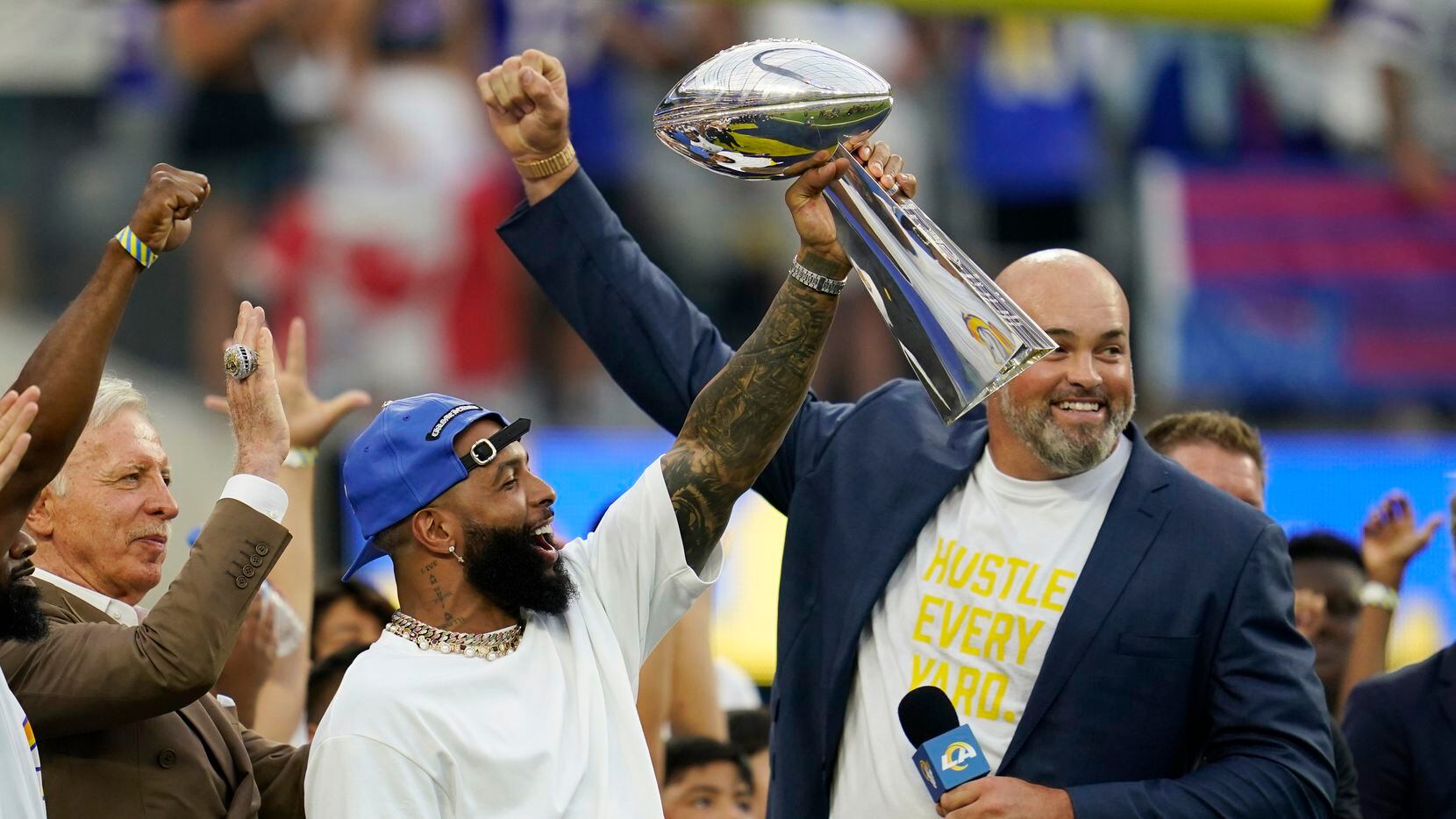 Former Los Angeles Rams wide receiver Odell Beckham Jr., center, lifts the 2021 championship...