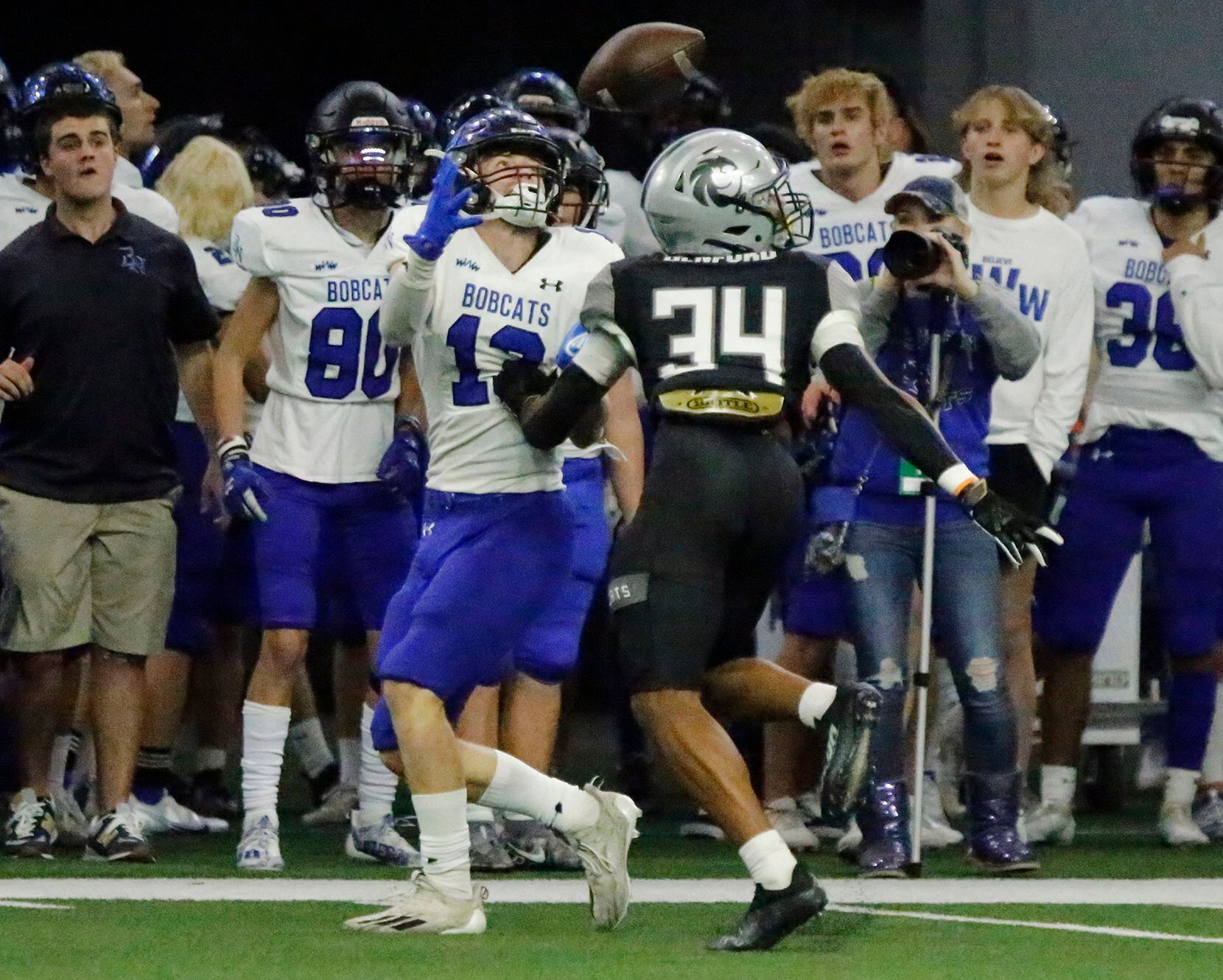 Byron Nelson High School wide receiver Gavin Mccurley (13) makes a catch over Guyer High School defensive back Anthony Benford (34) during the first half as Denton Guyer High School played Trophy Club Byron Nelson High School in a Class 6A Division II Region I semifinal football game at The Ford Center in Frisco on Saturday, November 27, 2021. (Stewart F. House/Special Contributor)
