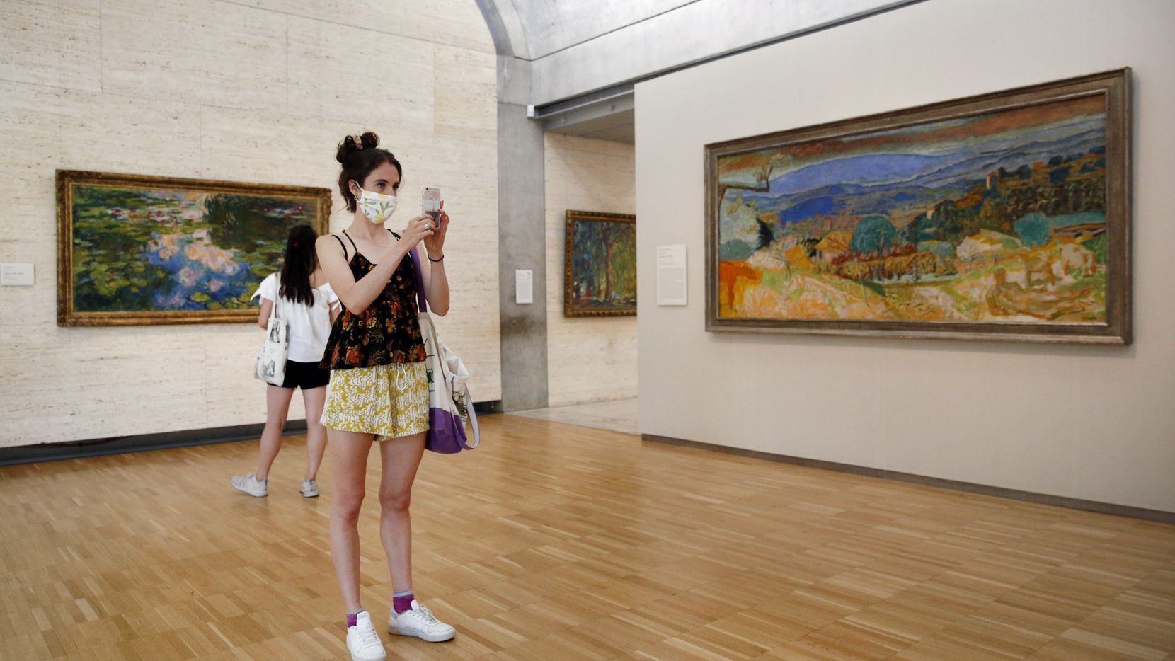 Libby Krueger of Fort Worth takes a photo of paintings in the Kimbell Art Museum as her...