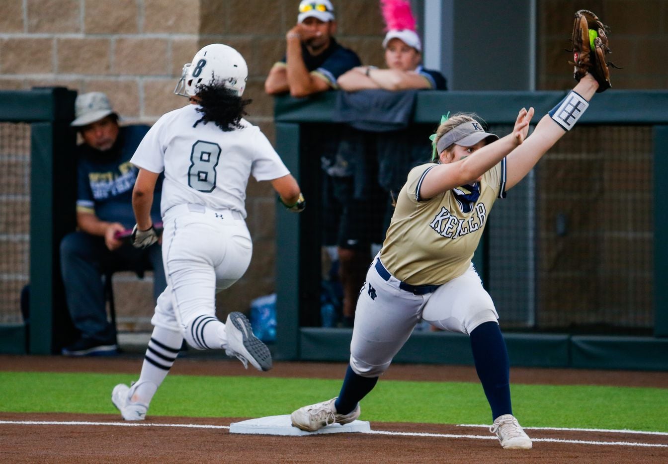 Denton Guyer's Tehya Pitts (8) is out at first base by Keller's Bella Smith (20) during the second inning of a nondistrict softball game in Denton on Tuesday, March 30, 2021. (Juan Figueroa/ The Dallas Morning News)