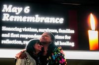 Cheryl Jackson (right) hugs Nina Majmundar as they arrive for a remembrance event at Credit...