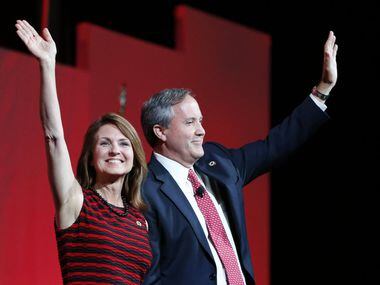 Texas Attorney General Ken Paxton and wife Angela wave to the crowd during the 2016 Texas...
