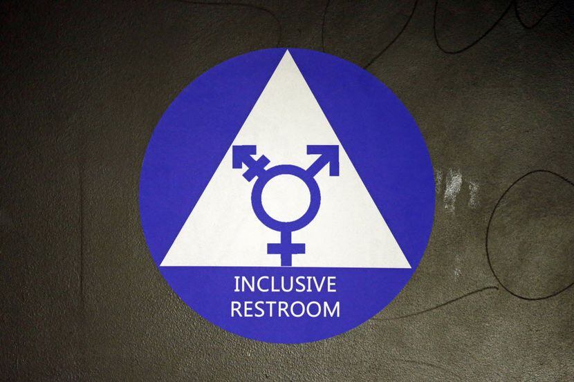 A sign designates a gender-neutral bathroom at Nathan Hale High School in Seattle. (2016...