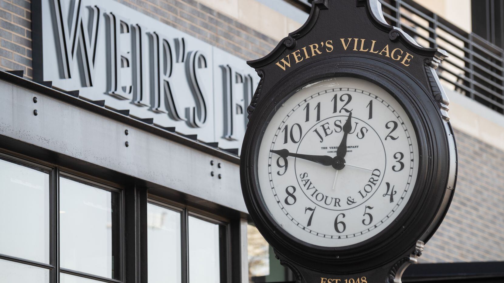 A restored clock from the old Weir's Furniture store is on display outside the new store on...