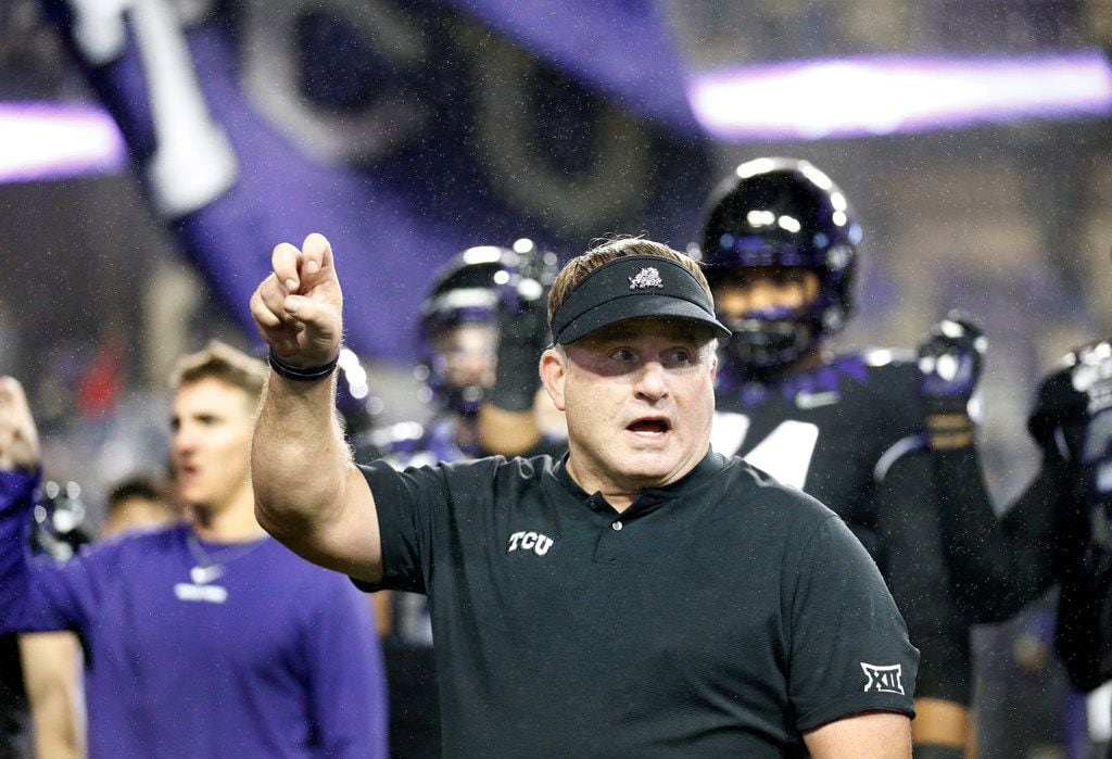 TCU Horned Frogs head coach Gary Patterson participates in the school song following their loss to the West Virginia Mountaineers at Amon G. Carter Stadium in Fort Worth, Friday, November 29, 2019. The Horned Frogs lost, 20-17.