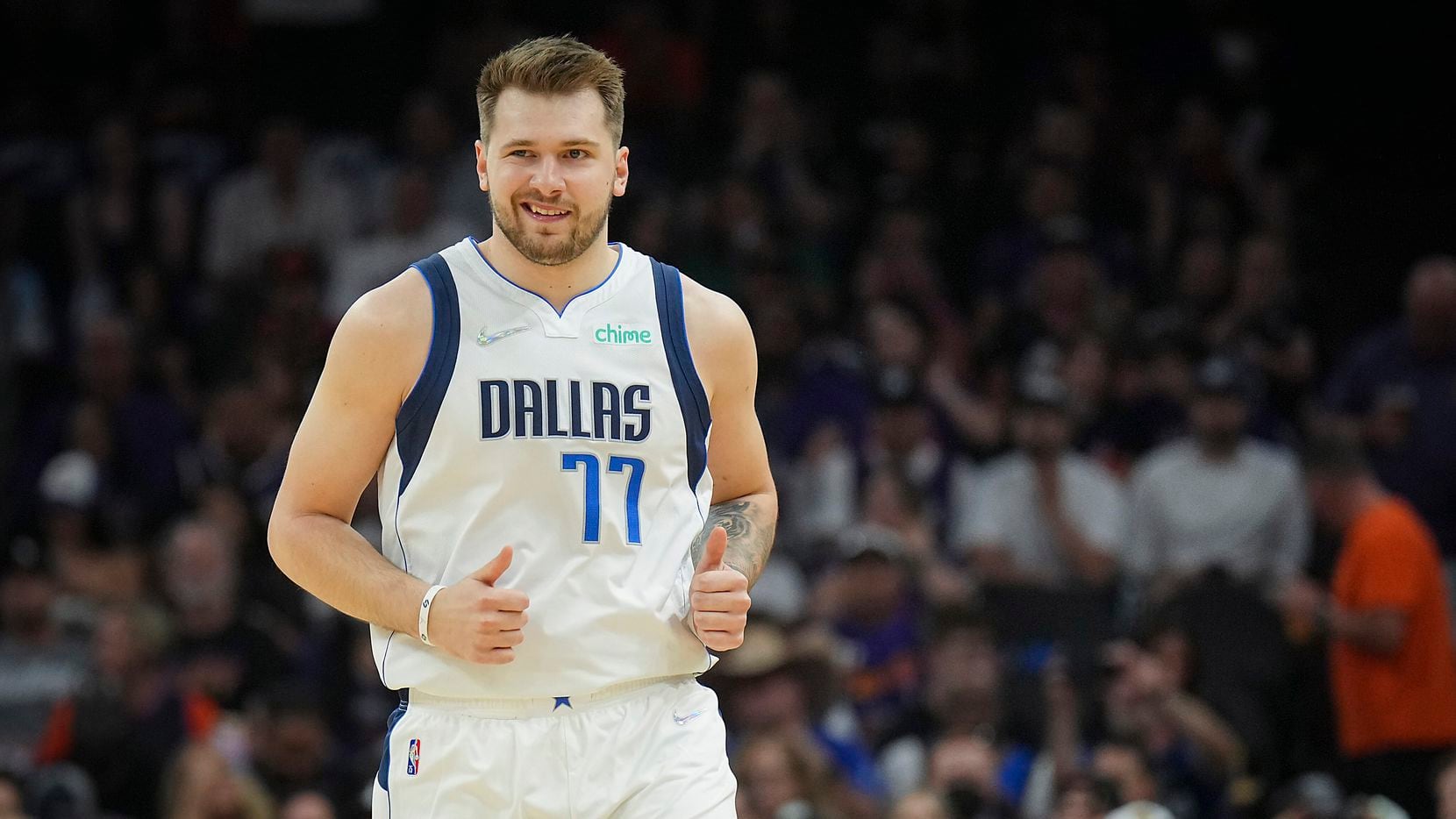 Dallas Mavericks guard Luka Doncic celebrates after hitting a 3-pointer during the first...