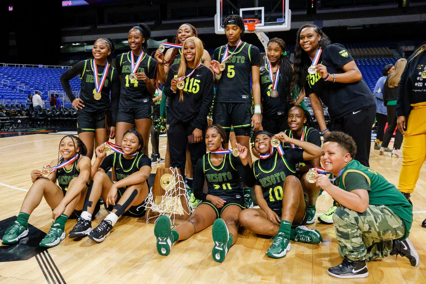 The DeSoto team poses with the Class 6A state championship trophy after defeating South...
