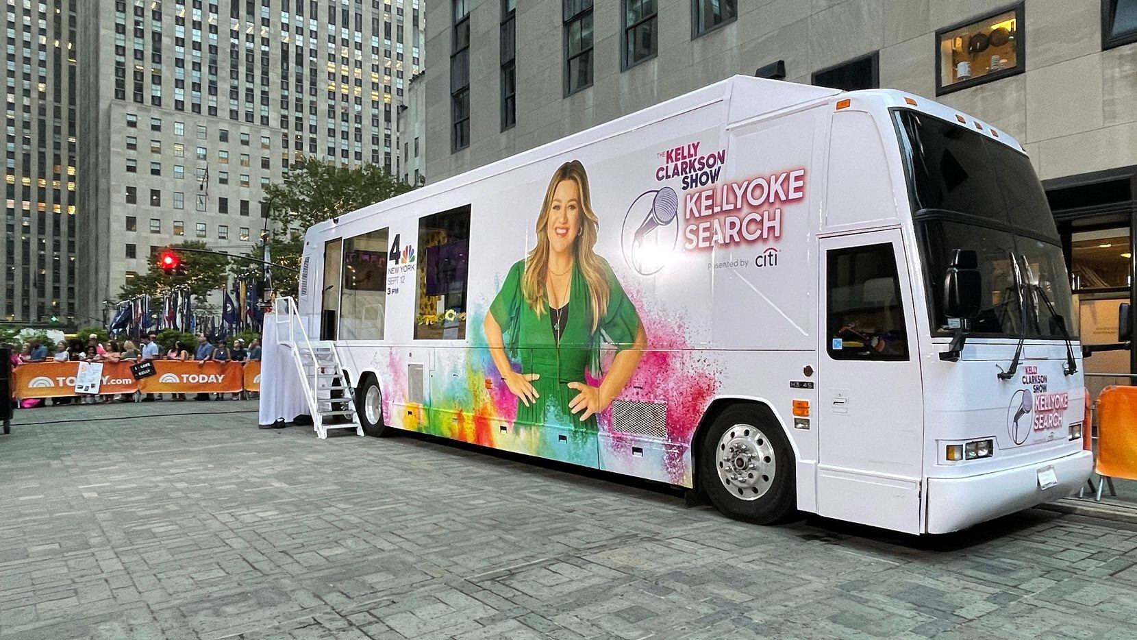 An exterior view shows "The Kelly Clarkson Show's" Kellyoke bus, which is coming Klyde...