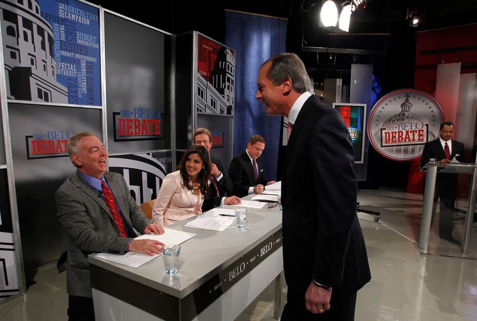 Republican candidate for the U.S. Senate, Lt.  Gov.  David Dewhurst, center, jokes with Dallas Morning News political reporter Wayne Slater before the start of the Belo debate Friday night April 13, 2012 at the WFAA studios in Dallas, Texas.  Four GOP hopefuls are vying for the seat of retired Sen. Kay Bailey Hutchison.