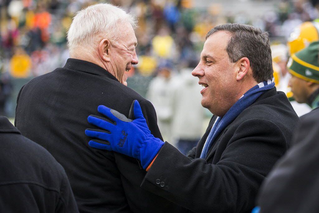 New Jersey Governor Chris Christie talks with Dallas Cowboys owner Jerry Jones on the...