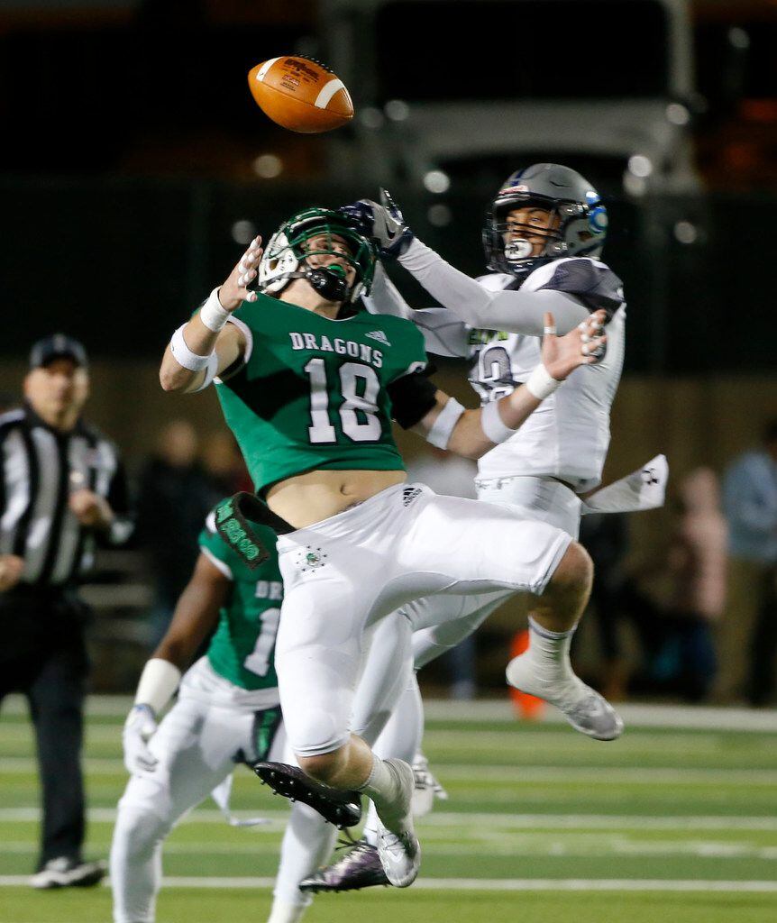 Southlake Carroll's Preston Forney (18) breaks up a pass intended for Eaton's Max McCuiston...