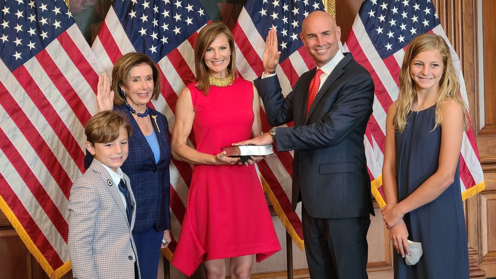 House Speaker Nancy Pelosi poses for a ceremonial swearing-in with Rep. Jake Ellzey of Ellis...