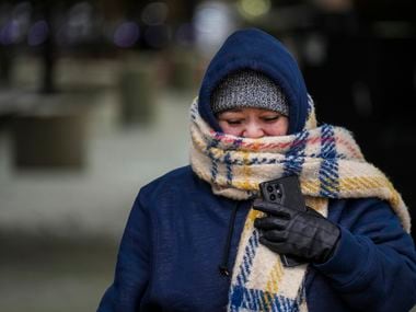 Camelia Rojas bundles up against the cold as she walks from the parking lot into Buc-ee's on...