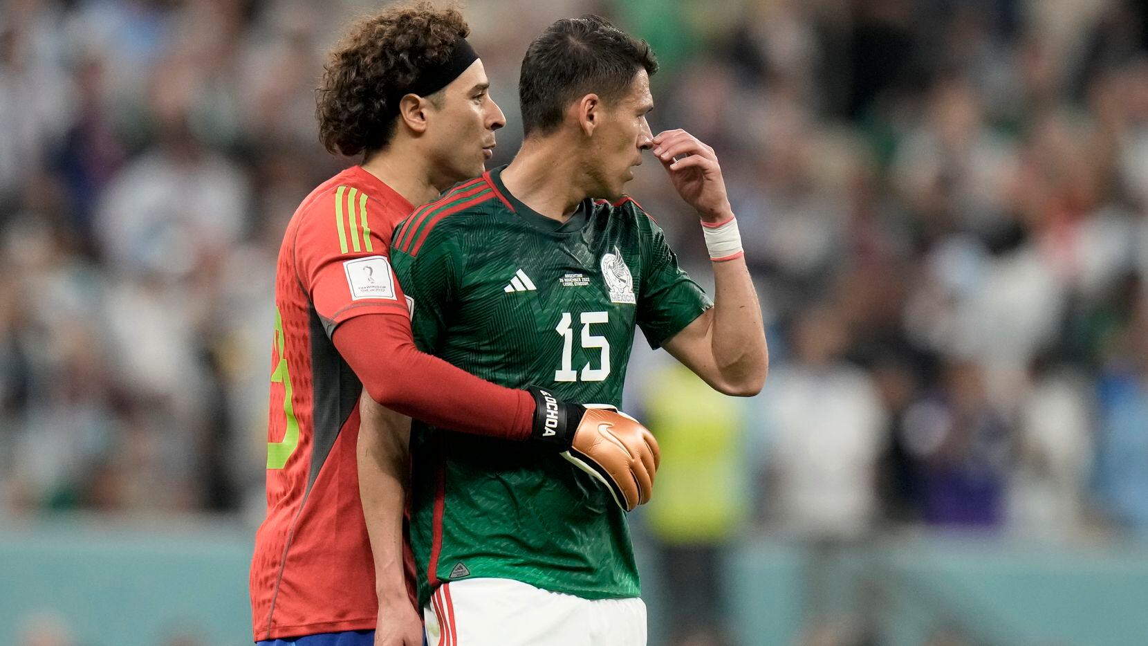 El arquero de México Guillermo Ochoa abraza Héctor Moreno (derecha) tras la derrota 2-0 en...
