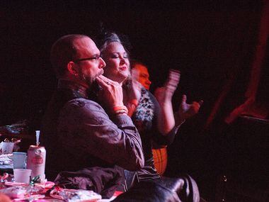 A couple cheers on the performers at the burlesque show Saturday night.