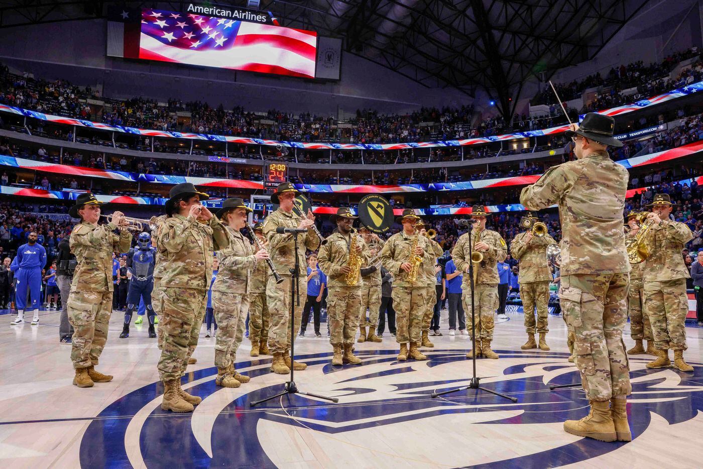 The U.S. Army First Cavalry Division Band perform the National Anthem before an NBA game...
