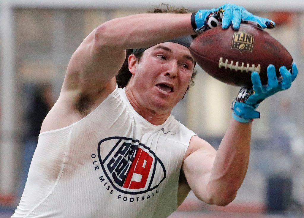 Former Mississippi tight end Dawson Knox reaches for a pass while getting tested by NFL...