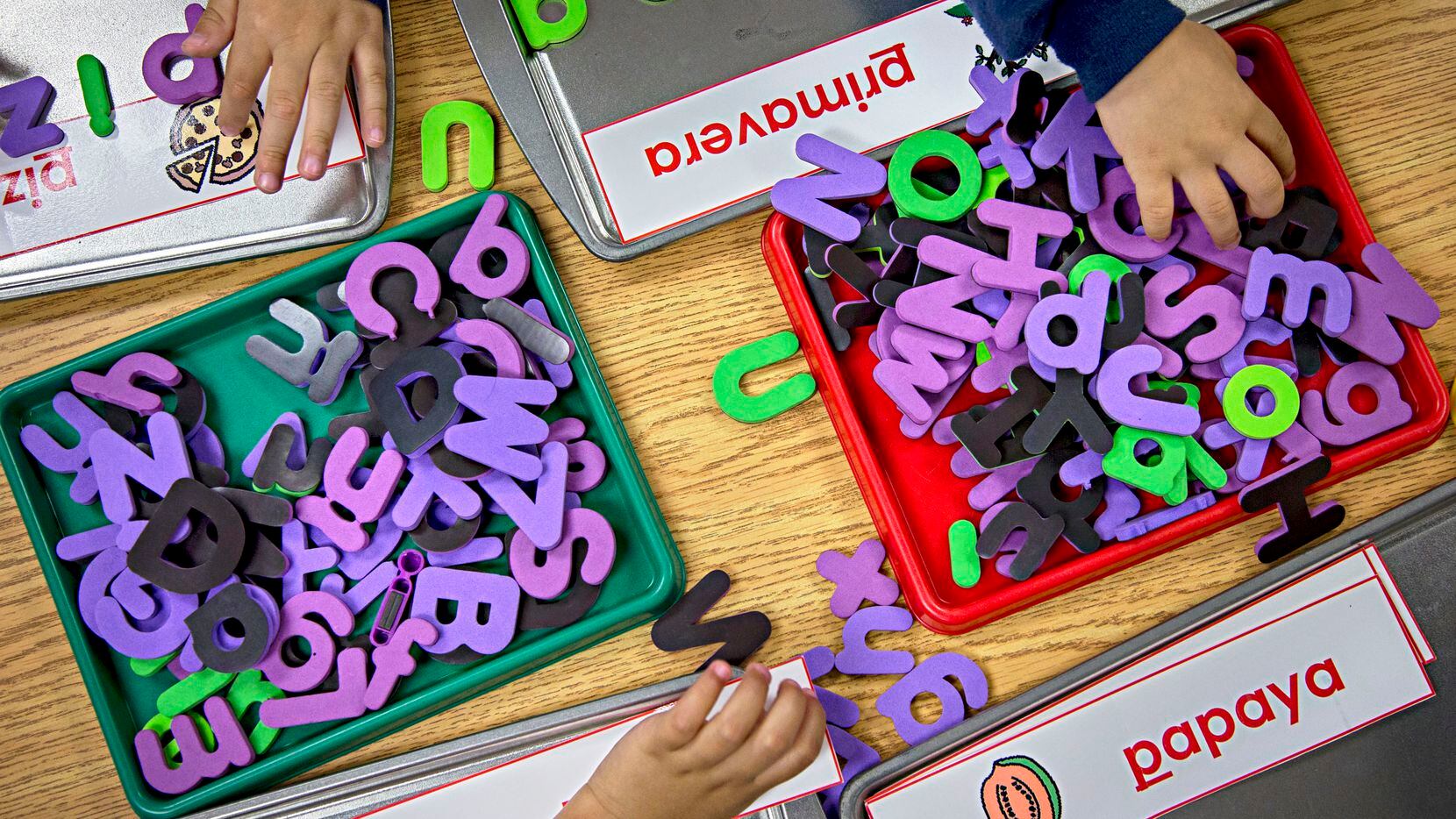 Prekindergarten students at Caillet Elementary School in northwest Dallas use letters to...