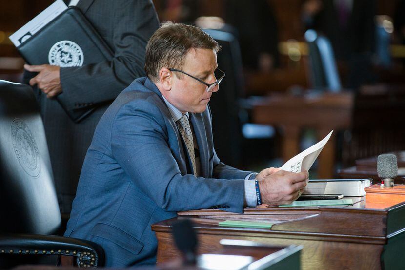 Then-state Sen. Pat Fallon looks over documents on the second day of the 86th Texas...
