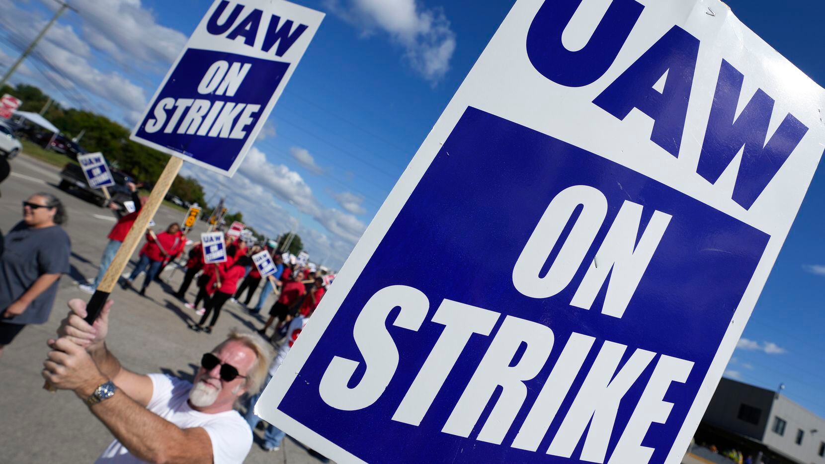 United Auto Workers members walk the picket line this week at the Ford Michigan Assembly...
