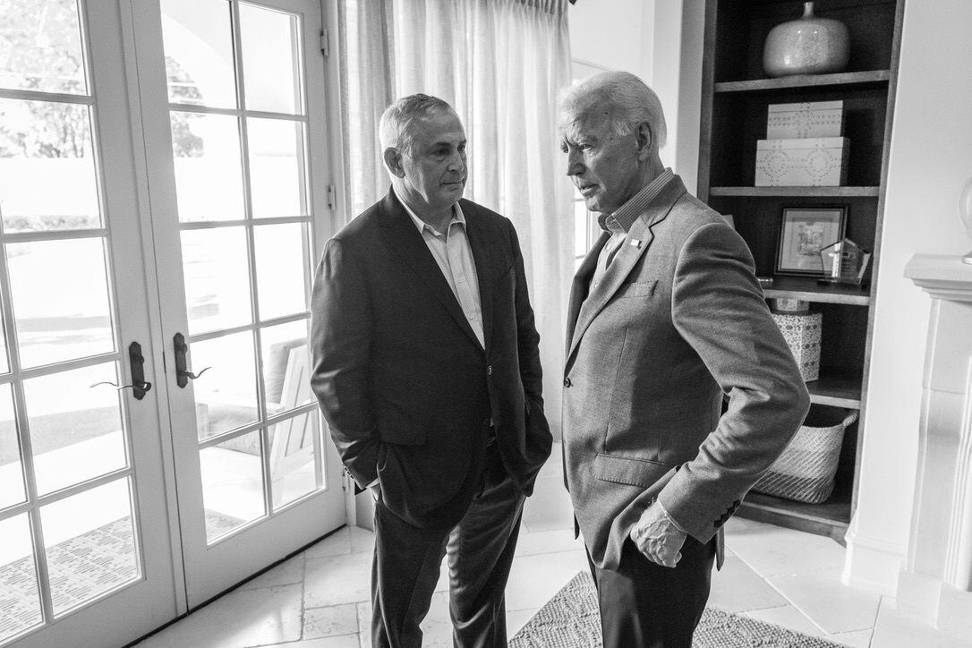 Dallas lawyer Marc Stanley speaks with Joe Biden on Sept. 14, 2019, at a Dallas fundraiser...