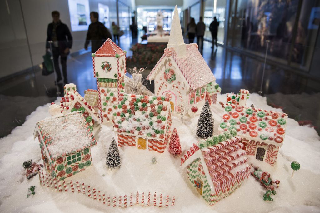 Artwork by Suzanne O'Brien is among Christmas decorations in NorthPark Center. This scene...