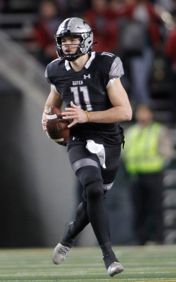 Denton Guyer quarterback Jackson Arnold (11) rolls out in search of a receiver during first half action against Tomball. The two teams played their  Class 6a Division ll state semifinal football playoff game at Baylor's McLane Stadium in Waco on December 11, 2021. (Steve Hamm/ Special Contributor)