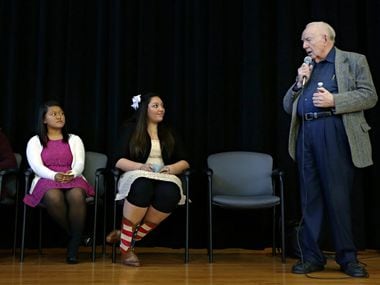 Dr. Robert McClelland spoke as students Sylvia Mualcin (left) and Kayla Conner listened on...