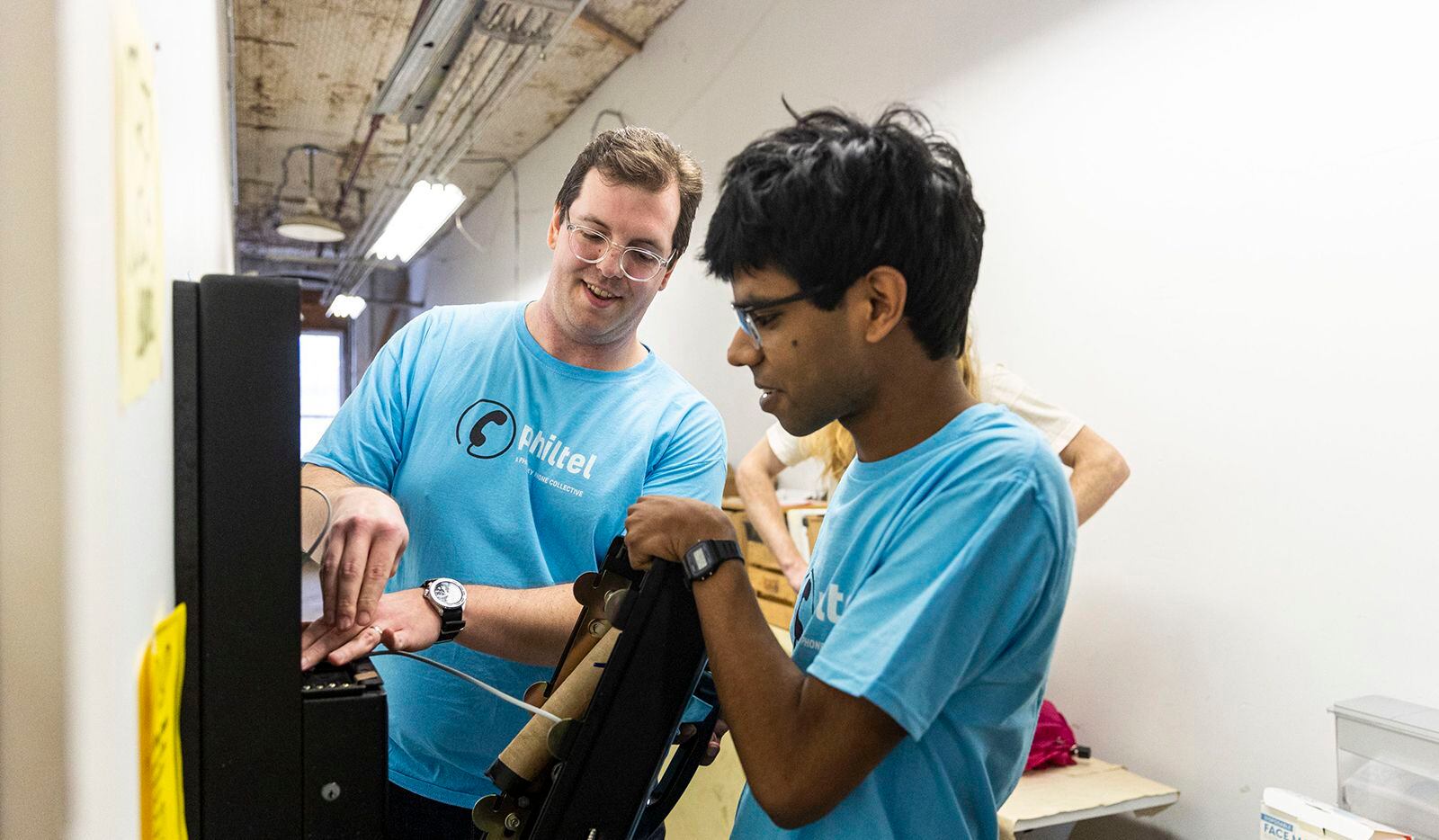 The co-founders of PhilTel, Mark Dank (left), and Naveen Albert, installed a free-to-use...