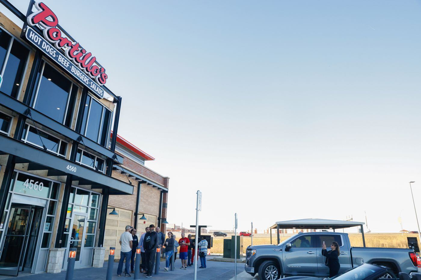 A line waits outside of Portillo’s for its first day open in The Colony on Monday, Jan. 9,...