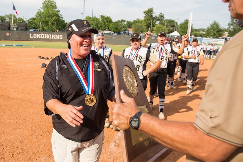 The Colony coach Deana Coleman, left, receives the state championship trophy at McCombs...