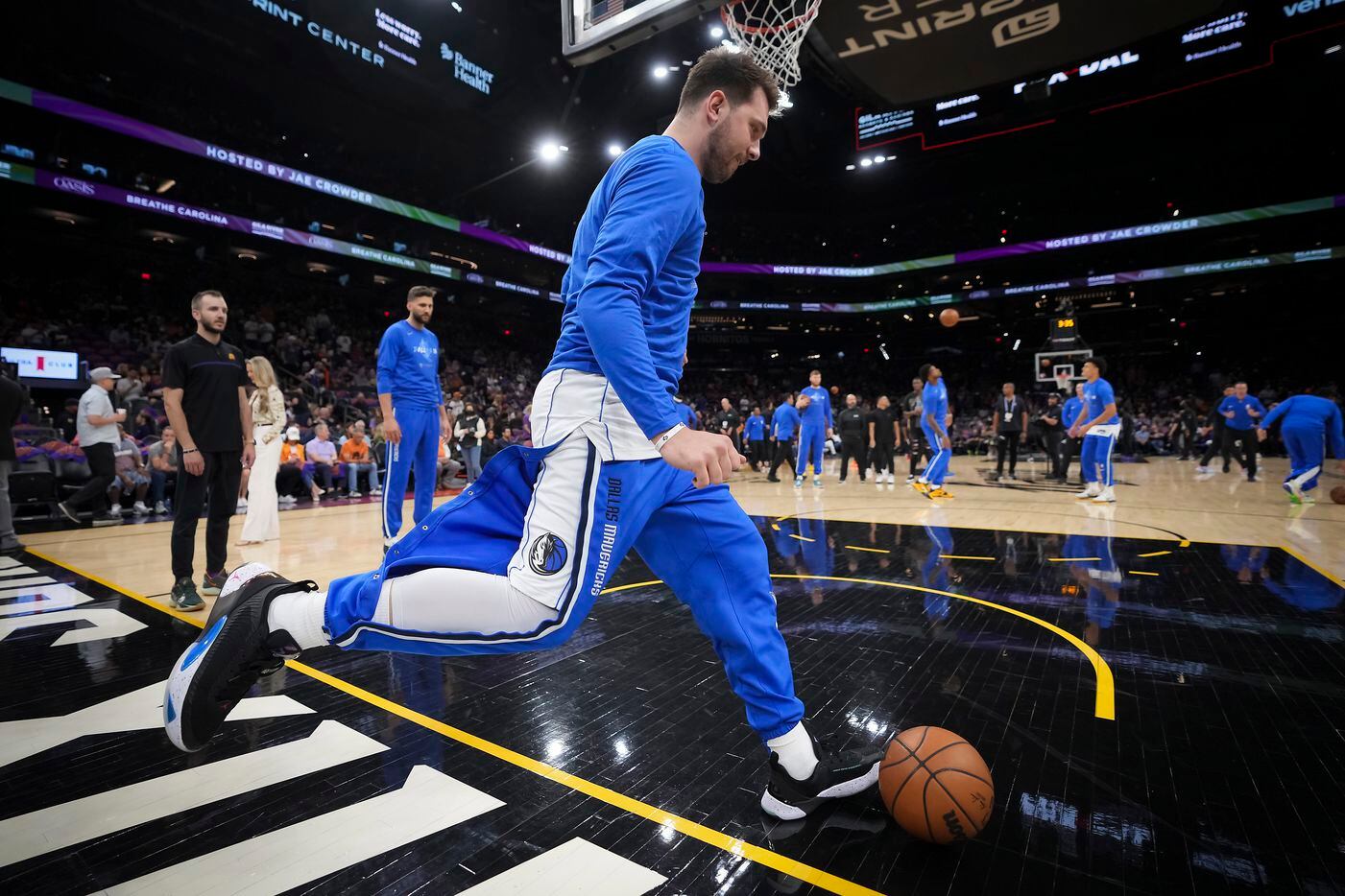 Dallas Mavericks guard Luka Doncic kicks a basketball as he warms up before Game 1 of an NBA...