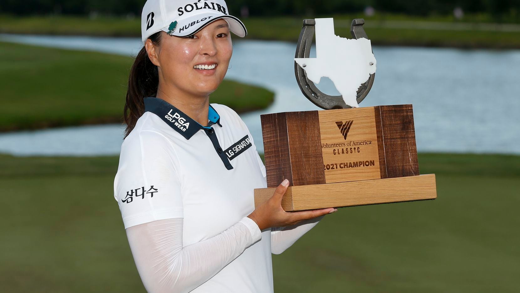 Professional golfer Jin Young Ko lifts the winner’s trophy after winning the LPGA VOA...