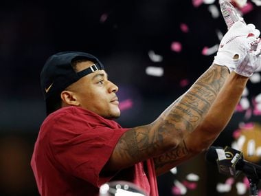 Alabama cornerback Patrick Surtain II celebrates during the trophy presentation after a win against Notre Dame in the Rose Bowl CFP semifinal at AT&T Stadium on Friday, Dec. 30, 2020, in Arlington.