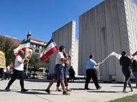 Around 30 people gathered to protest the Iranian government, Sunday, Oct. 2, 2022 in Dallas....