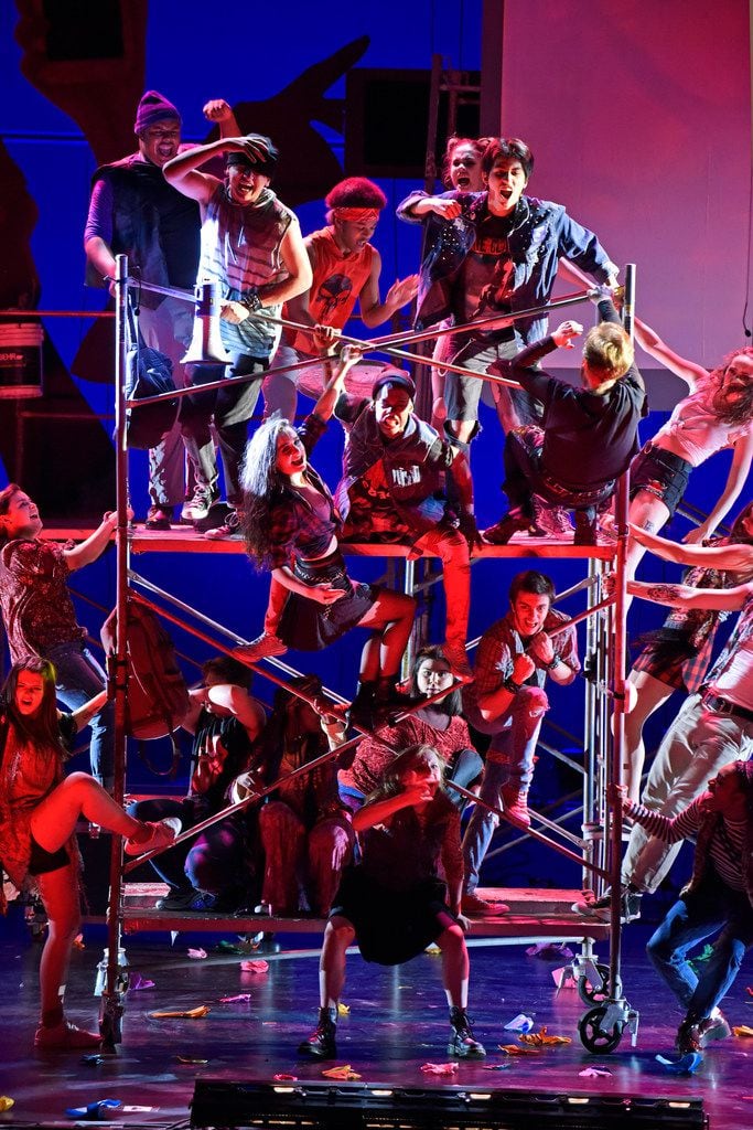 Actors stack rolling scaffolding in Junior Players' production of Green Day's American...