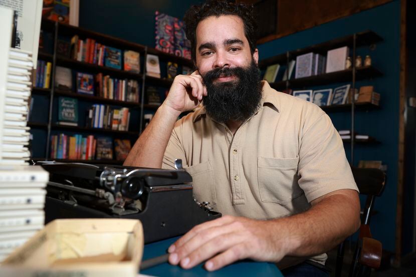 Marcos Cavazos, owner of Poets Oak Cliff Bookshop poses for a portrait, Wednesday, July 20,...