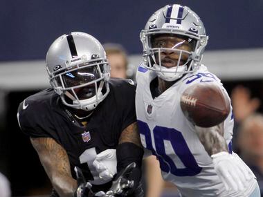 Dallas Cowboys cornerback Anthony Brown (30), right, deflects a pass in the end zone...