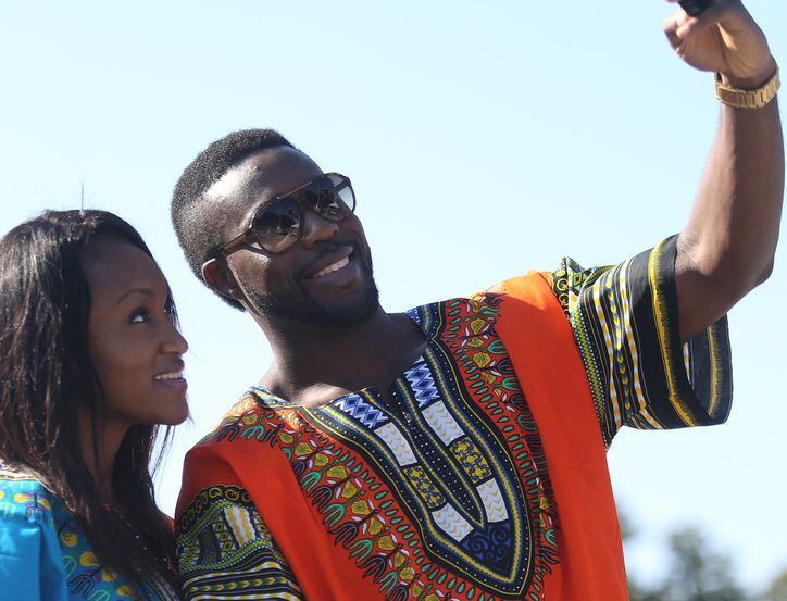 Ogechi Nwadinobi (left), and Jameson Onyebuchi take a selfie at A Taste of Nigeria festival.