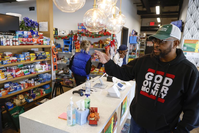 Southpoint Community Market employee Calvin Freeney, points towards the item inside the...