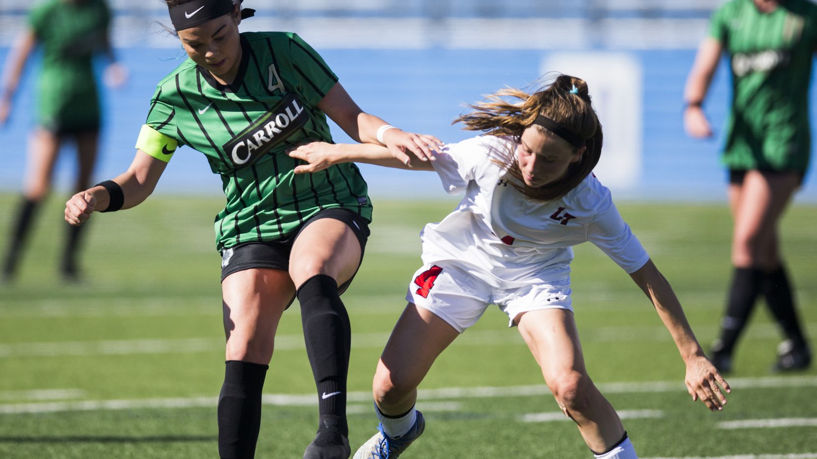 Southlake Carroll forward Taylor Tufts (4) takes the ball from Austin Lake Travis defender Bronwyn Bates (4) during the first half of a UIL conference 6A girls state semifinal soccer game between Southlake Carroll High School and Lake Travis High School on Friday, April 19, 2019 at Birkelbach Field in Georgetown, Texas. (Ashley Landis/The Dallas Morning News)