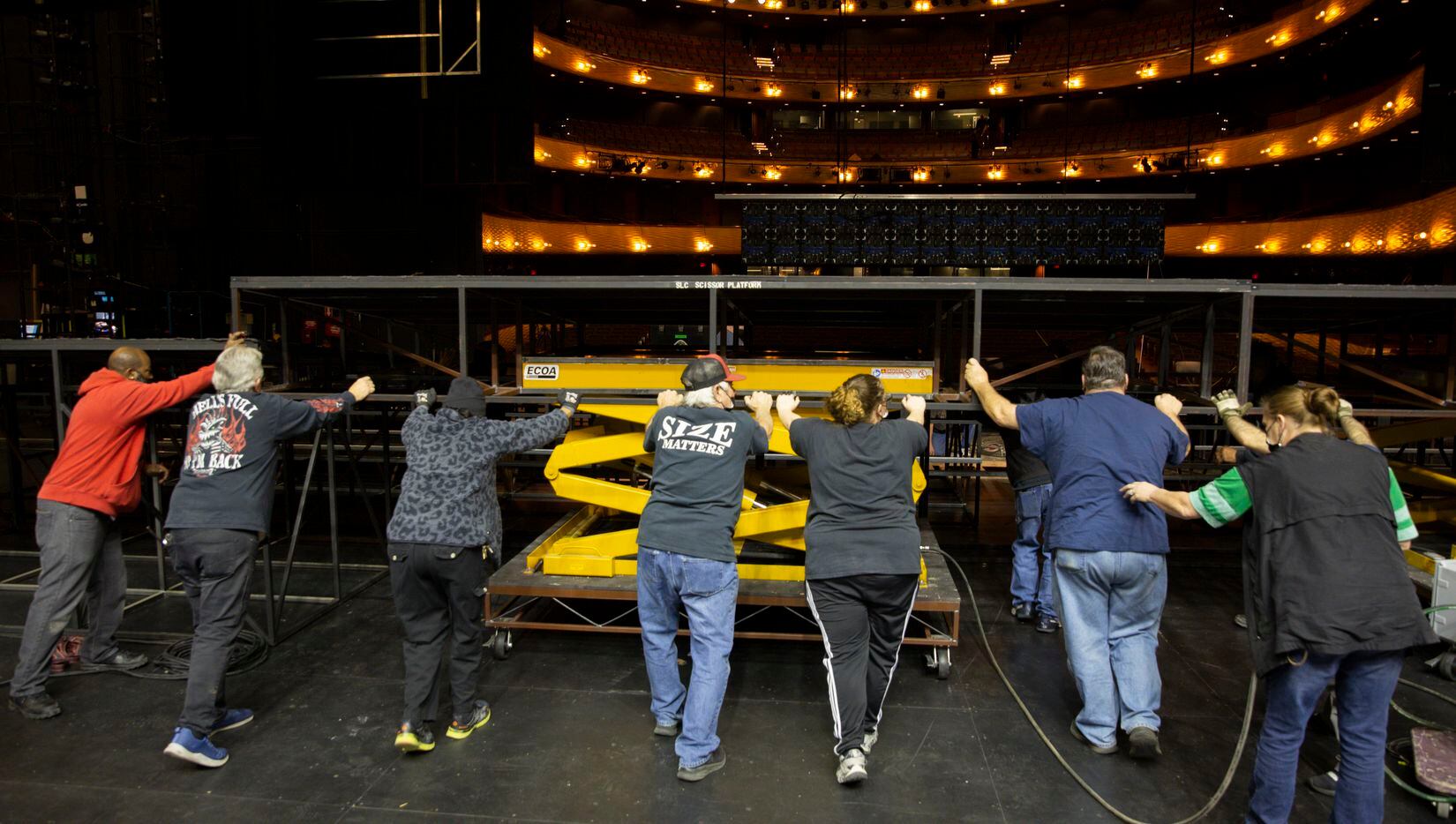 The AT&T Performing Arts Center crew put into place a stage piece made by Dallas Stage...