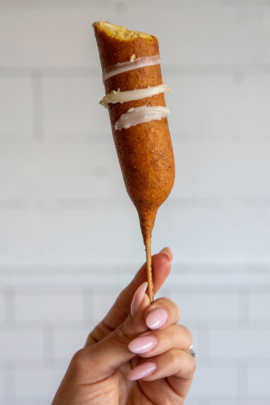 One of CornDog With No Name's meat-free 'dogs is the cheese: mozzarella cheese, dipped in corn dog batter and fried in peanut oil.