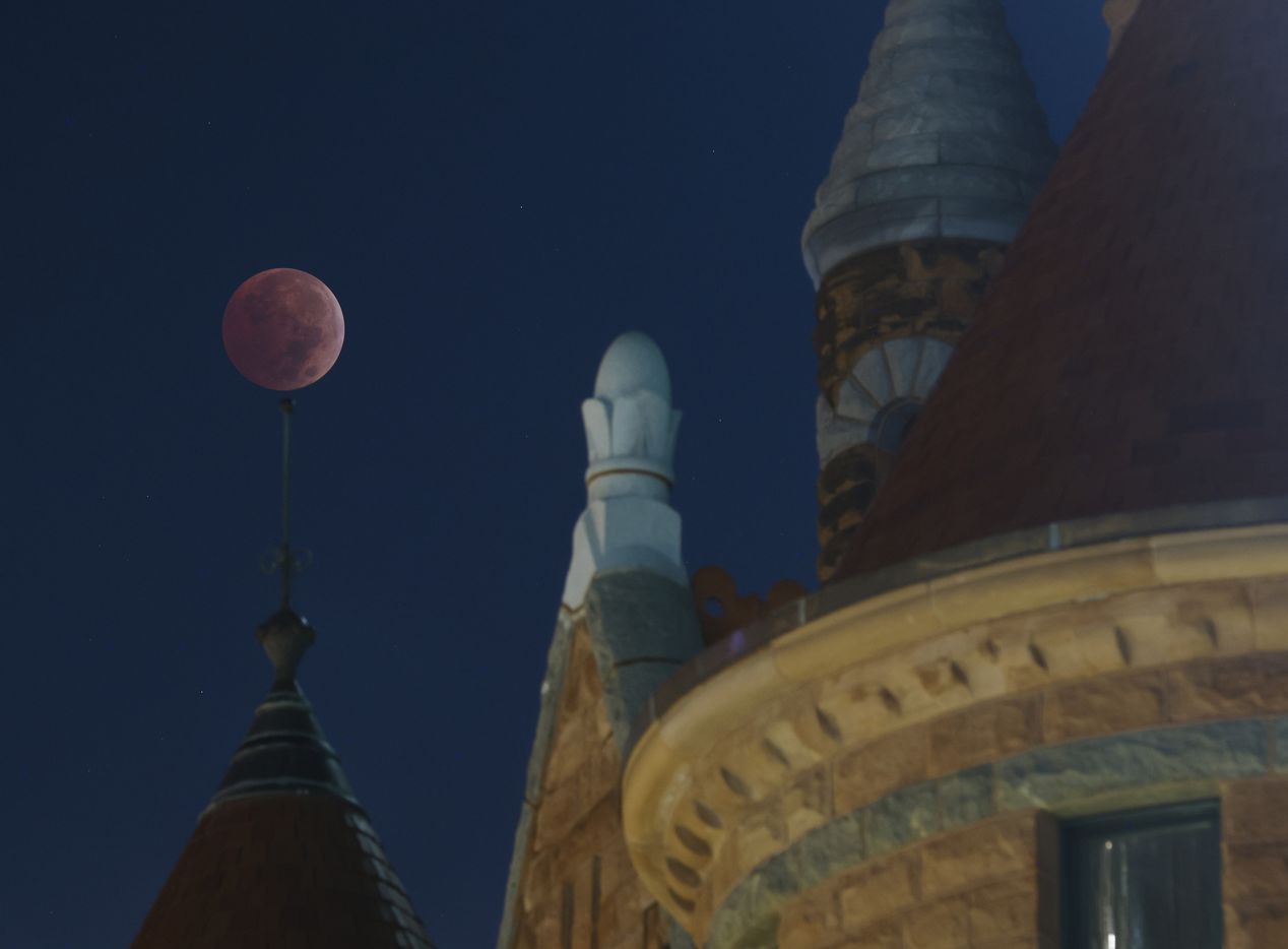 The blood moon lunar eclipse is seen by the Old Red Museum of Dallas County History and...